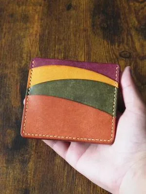 The All-in-One Wallet. Three quick-access card slots, a press-stud coi